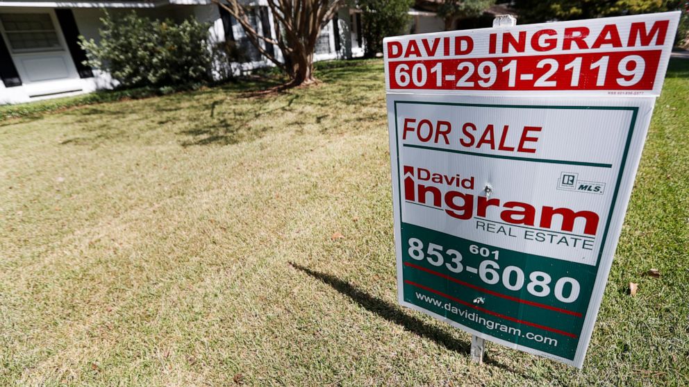 In this Sept. 25, 2019, photo a realtor's sign sits outside a house for sale in Jackson, Miss. On Thursday, Oct. 3, Freddie Mac reports on this week’s average U.S. mortgage rates. (AP Photo/Rogelio V. Solis)