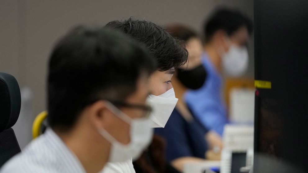 Currency traders watch computer monitors at the foreign exchange dealing room in Seoul, South Korea, Friday, July 9, 2021. Shares were mostly lower in Asia on Friday after stocks pulled back from their recent record highs on Wall Street as bond yield