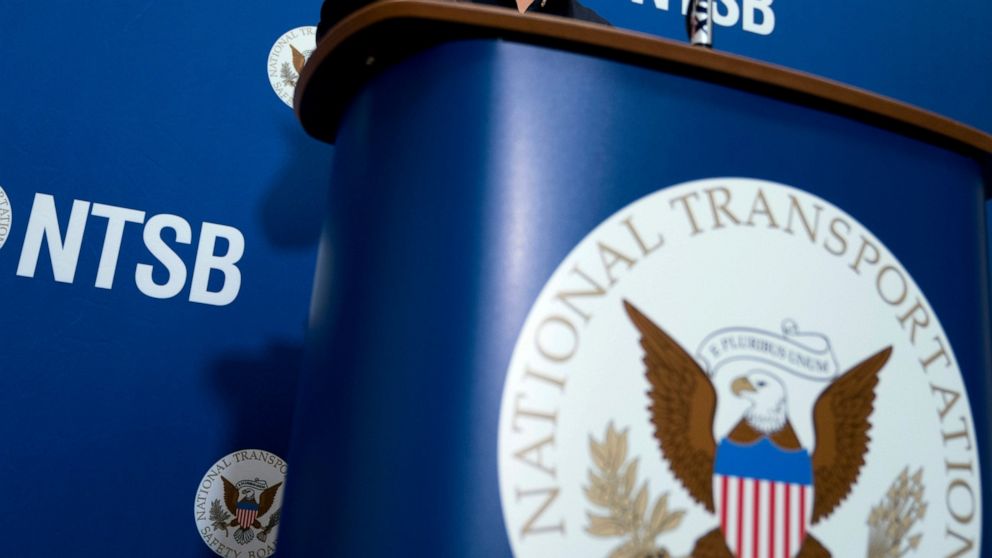 FILE - The National Transportation Safety Board logo and signage are seen at a news conference at NTSB headquarters in Washington, Dec. 18, 2017. On Friday, Sept. 9, 2022, the National Transportation Safety Board and the Federal Aviation Administrati