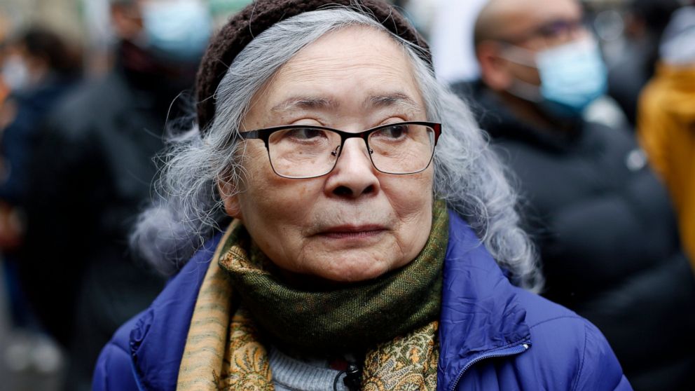 Tran To Nga, a 78-year-old former journalist, attends a gathering in support of people exposed to Agent Orange during the Vietnam War, in Paris, Saturday Jan. 30, 2021. Activists gathered Saturday in Paris in support of people exposed to Agent Orange