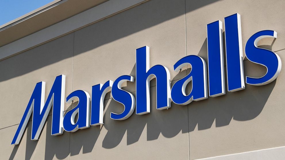 FILE - In this May 16, 2017, file photo a sign hangs outside a Marshalls store in Cincinnati. The off-price chain, owned by TJX Cos., went live online Tuesday, Sept. 24, 2019, featuring different designers and brands that complement what shoppers can
