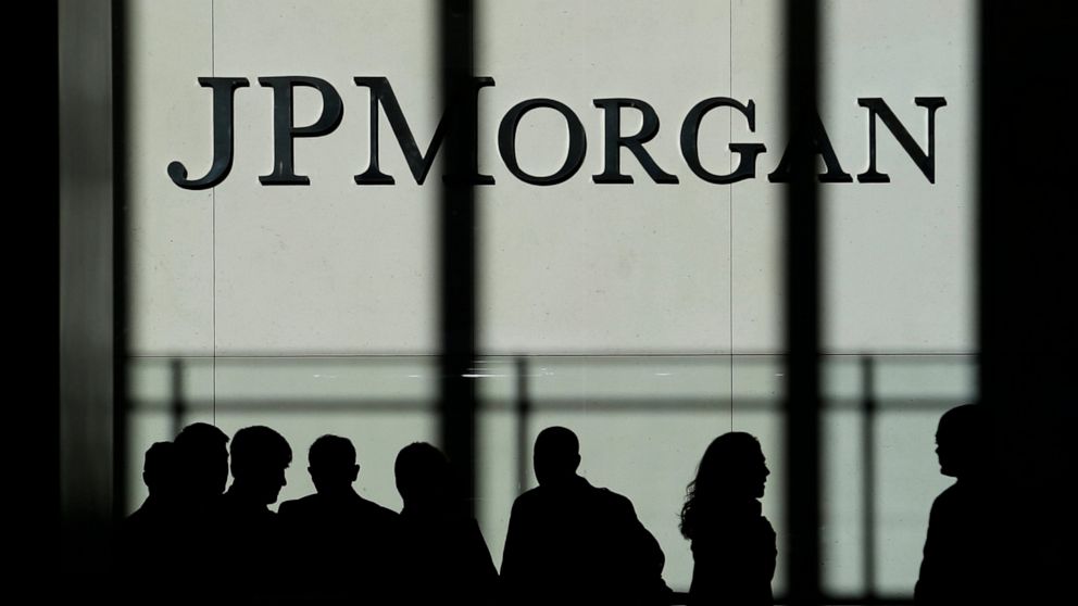 FILE - In this Oct. 21, 2013, file photo, the JPMorgan Chase logo is displayed at their headquarters in New York. Banking giant JPMorgan Chase said that its fourth-quarter profits jumped 21% from a year earlier, as the bank's trading desks had a blow