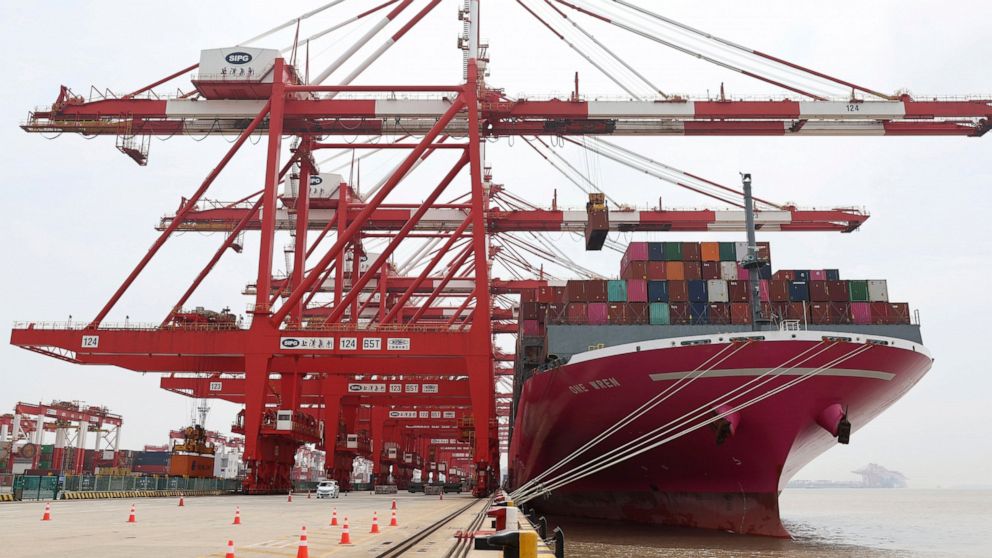 In this photo released by Xinhua News Agency, a container ship from Japan is anchored at the container dock of Shanghai's Yangshan Port in east China on April 27, 2022. China's export growth tumbled in April after Shanghai and other industrial cities