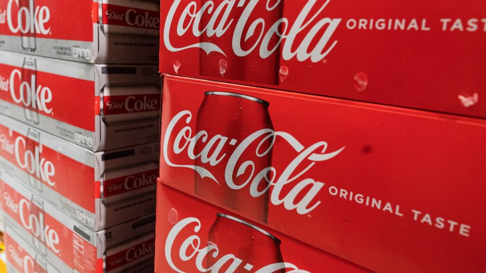 Cases of Coca-Cola are displayed in a supermarket, Monday, April 5, 2021 in New York. Coca-Cola Co. saw higher-than-expected sales in the second quarter, Wednesday, July 21, as the impact of the pandemic abated. The Atlanta-based soft drink giant sai