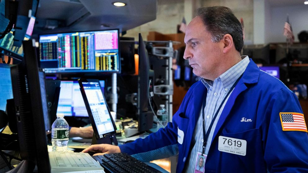 Trader James Conti works on the floor, Monday, March 14, 2022, in this photo provided by the New York Stock Exchange. Stocks are losing ground on Wall Street in choppy trading Monday afternoon and bond yields are rising sharply as anxiety over the wa