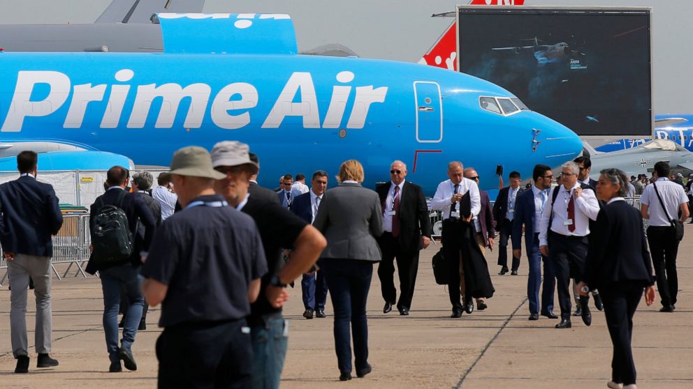 Visitors walk past an Boeing 737-800 BCF Amazon "Prime Air" cargo plane at Paris Air Show, in Le Bourget, east of Paris, France, Tuesday, June 18, 2019. The world's aviation elite are gathering at the Paris Air Show with safety concerns on many minds