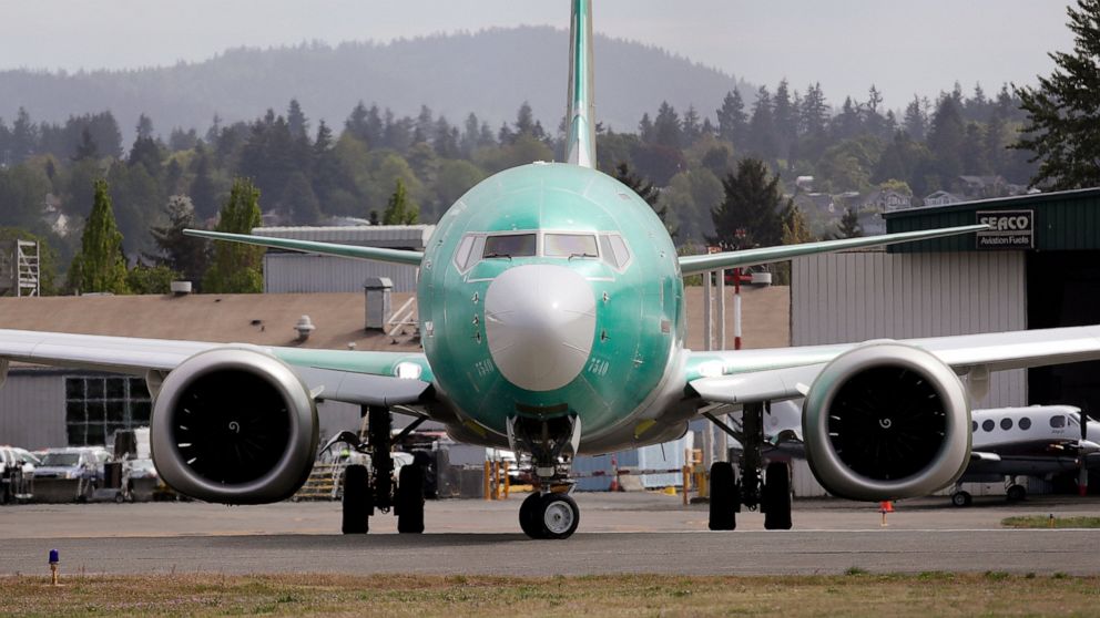 FILE - In this may 8, 2019 photo, a Boeing 737 MAX 8, being built for American Airlines, makes a turn on the runway as it's readied for takeoff on a test flight in Renton, Wash. Two key lawmakers said Friday, June 7, 2019, that Boeing planned to dela
