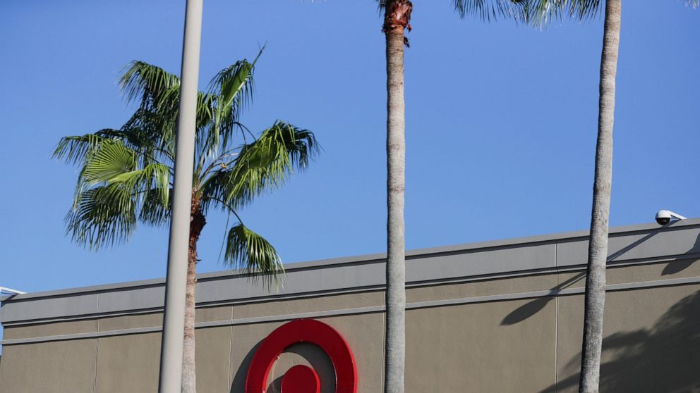 FILE - In this Oct. 3, 2018, file photo customers shop at a Target department store in Pembroke Pines, Fla. Target is launching a private food label next month as it attempts to energize grocery sales. On Sept. 15, 2019, 650 products will appear on s