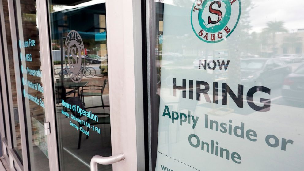 FILE - In this Nov. 4, 2019, file photo a job posting is displayed near the entrance outside a restaurant in Orlando, Fla. Two reports last week show that small business hiring still lags behind the strong job growth reported at larger companies, and