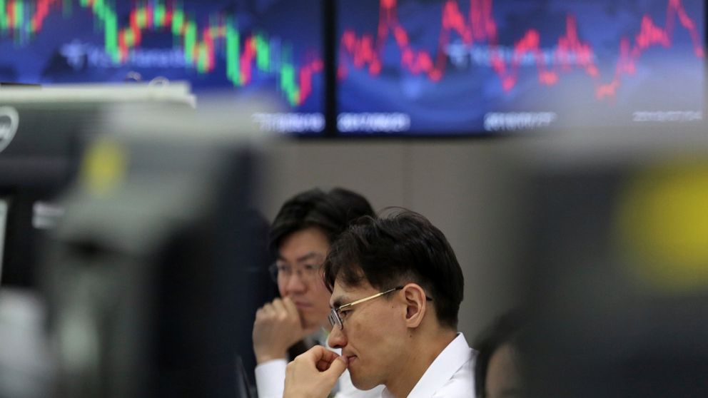 Currency traders watch monitors at the foreign exchange dealing room of the KEB Hana Bank headquarters in Seoul, South Korea, Thursday, July 4, 2019. Shares opened higher in Asia on Thursday after U.S. stocks closed broadly higher, sending the S&P 50