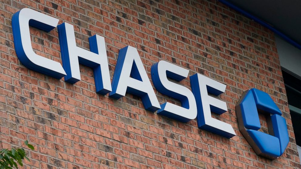 A Chase bank sign is shown in Richmond, Va., Wednesday, June 2, 2021. JPMorgan Chase’s said, Friday, Jan. 14, 2022 its fourth quarter profits fell 14% from a year earlier, as the company saw a weaker performance out of its trading desk and had higher