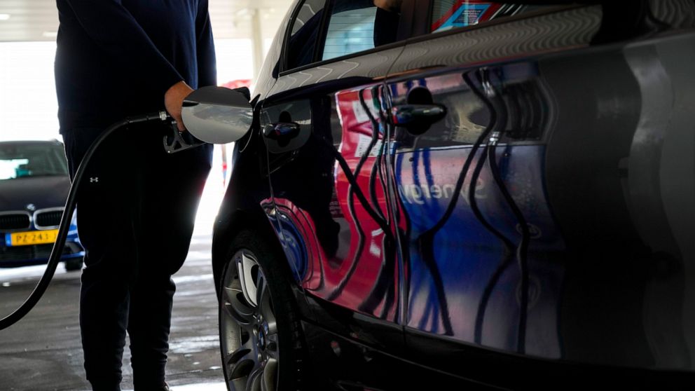 FILE - Motorists in the Netherlands headed to the pumps after a government reduction in duties on fuel entered into force to help motorists hit by soaring fuel prices, in Amsterdam, Netherlands, Friday, April 1, 2022. Inflation hit a new record for t