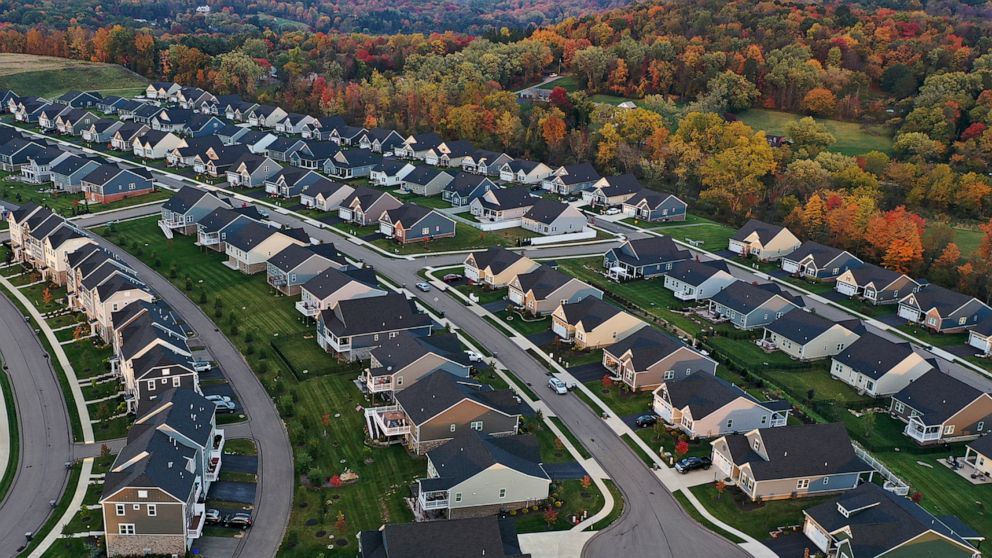 FILE - A cul-de-sac runs through a new housing development in Middlesex Township, Pa., on Oct. 12, 2022. The sharp rise in borrowing costs that helped torpedo the U.S. housing market in 2022 has been partly driven by a wider-than-usual divergence bet