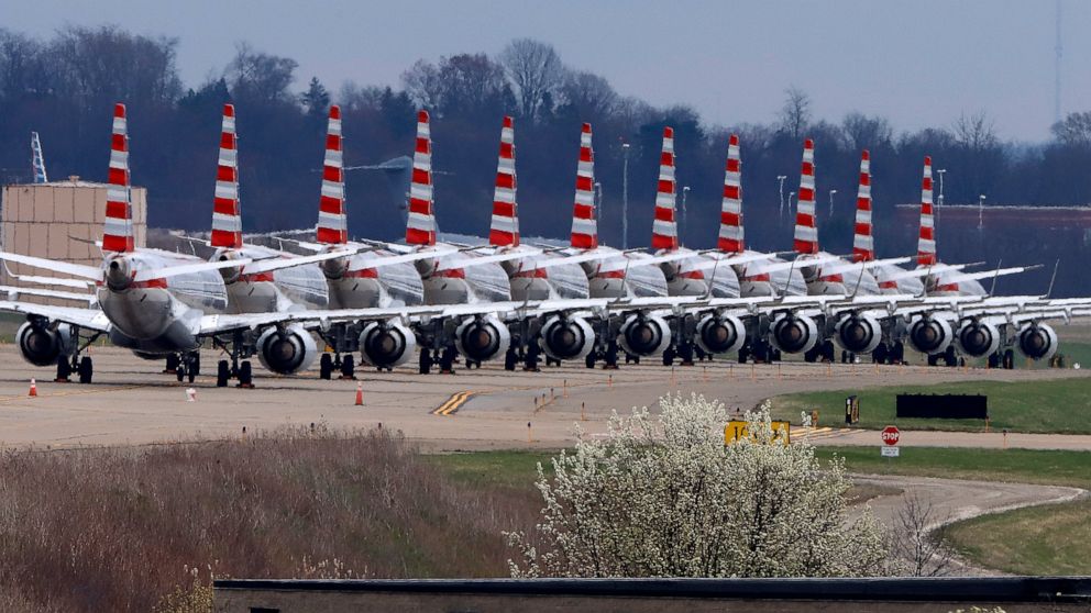 FILE - In this March 31, 2020 file photo, American Airlines planes stored at Pittsburgh International Airport sit idle on a closed taxiway in Imperial, Pa. American Airlines reported a staggering loss of $2.24 billion for the first quarter, when the 