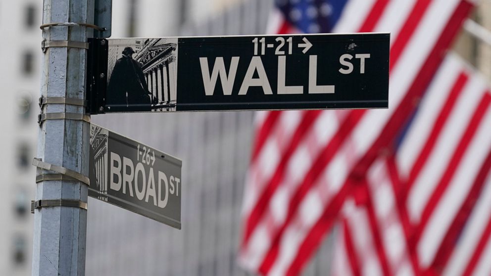 FILE - A street sign is seen in front of the New York Stock Exchange in New York, Tuesday, June 14, 2022. Stocks are opening broadly higher on Wall Street Tuesday, June 21, clawing back some of the ground they lost in their worst weekly drop since th