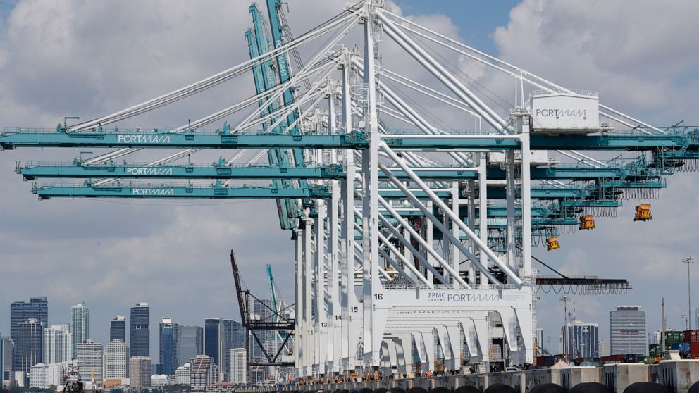In this July 24, 2019 photo, large cranes to unload container ships are shown at PortMiami in Miami. On Wednesday, Sept. 4, the Commerce Department reports on the U.S. trade gap for July. (AP Photo/Wilfredo Lee)