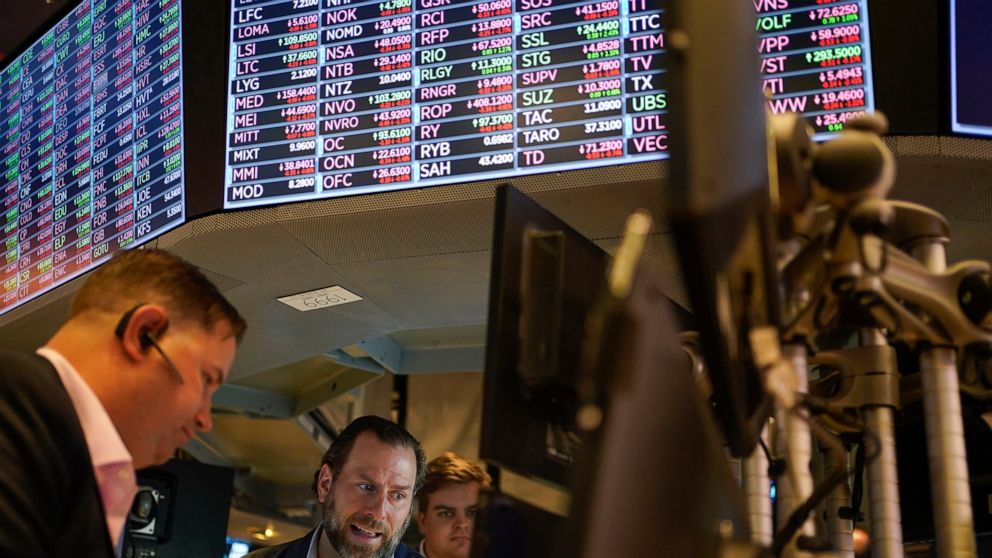 FILE - Traders work on the floor at the New York Stock Exchange in New York, May 19, 2022. Stocks are opening lower on Wall Street Tuesday, May 24, 2022 led by drops in tech heavyweights like the parent companies of Facebook and Google. The S&P 500 i