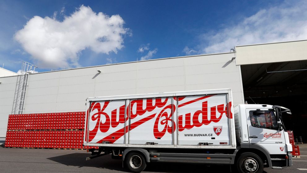 FILE - In this file photo taken Monday, March 11, 2019, a truck drives past cases of beer at the Budejovicky Budvar brewery in Ceske Budejovice, Czech Republic. Budejovicky Budvar NP, a Czech state-owned brewery, said Wednesday June 24, 2020, that it