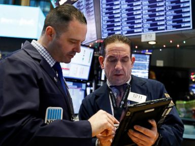Stocks open slightly higher on upbeat earnings, forecasts