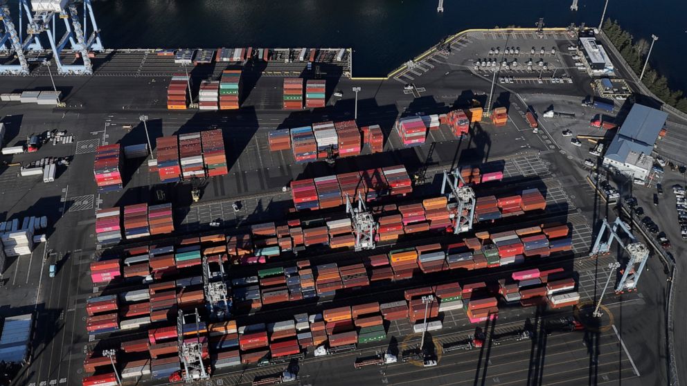 FILE - In this March 5, 2019, file photo, cargo containers are staged near cranes at the Port of Tacoma, in Tacoma, Wash. On Thursday, June 6, the Commerce Department reports on the U.S. trade gap for April. (AP Photo/Ted S. Warren, File)