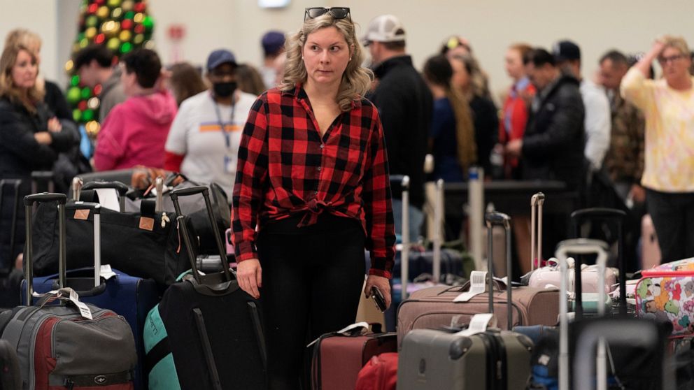 Ashlyn Harmon of New Orleans searches for her Southwest Airlines bags amongst hundreds of others at Midway International Airport as Southwest continues to cancel thousands of flights across the country Wednesday, Dec. 28, 2022, in Chicago. Harmon sai