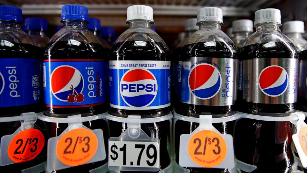 FILE - In this April 23, 2018, photo, Pepsi soft drink bottles are displayed at a store in Windham, N.H. PepsiCo Inc. reports earns on Tuesday, July 9, 2019. AP Photo/Charles Krupa, File)