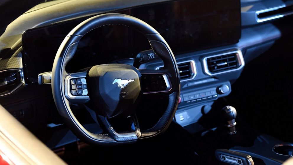 FILE - Part of the interior is seen of a 2024 Ford Mustang convertible at the North American International Auto Show on Sept. 14, 2022, in Detroit. A parts shortage that has thousands of Ford's most-profitable vehicles sitting on lots waiting to be f