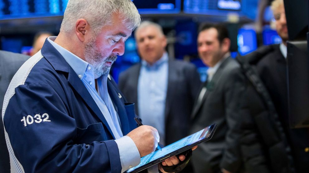 In this photo provided by the New York Stock Exchange, trader James McCarthy works on the floor, Wednesday, April 27, 2022. Stocks shook off a wobbly start and gained ground in late morning trading on Wall Street Wednesday, after a big sell-off of te