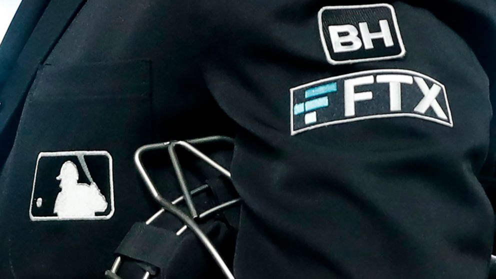 FILE - The FTX logo appears on a home plate umpire's jacket at a baseball game with the Minnesota Twins on Sept. 27, 2022, in Minneapolis. Collapsed cryptocurrency trading firm FTX confirmed there was “unauthorized access” to its accounts, hours afte