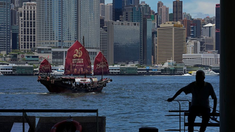 A Chinese junk sails across Victoria Harbor to celebrate the 25th anniversary of Hong Kong handover to China, in Hong Kong, Monday, June 27, 2022. As the former British colony marks the 25th anniversary of its return to China, reeling from pandemic c