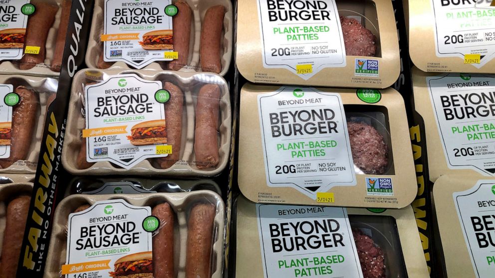 FILE - Packages of Beyond Meat's Beyond Burgers and Beyond Sausage, are shown in this photo, in New York, on April 29, 2021. The plant-based meat maker said Thursday, Aug. 4, 2022, it’s laying off 4% of its workforce after a difficult second quarter 