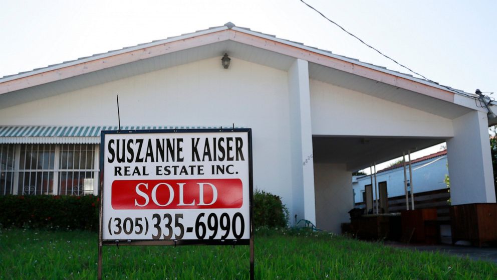 FILE - In this April 12, 2019, file photo, a sold sign is shown in front of a home in Surfside, Fla. On Thursday, June 13, Freddie Mac reports on this week’s average U.S. mortgage rates. (AP Photo/Wilfredo Lee, File)