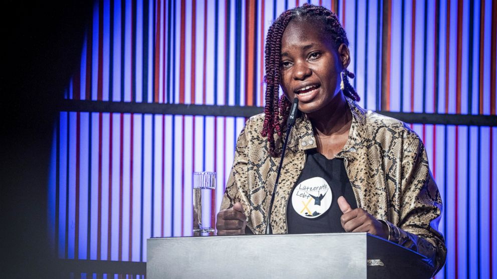 FILE - Hilda Nakabuye, Fridays for Future activist from Uganda, speaks at the opening of the Berlin Energy Transition Dialogue at the Federal Foreign Office in Berlin, March 29, 2022. Climate activists are urging more banks and insurers not to back t