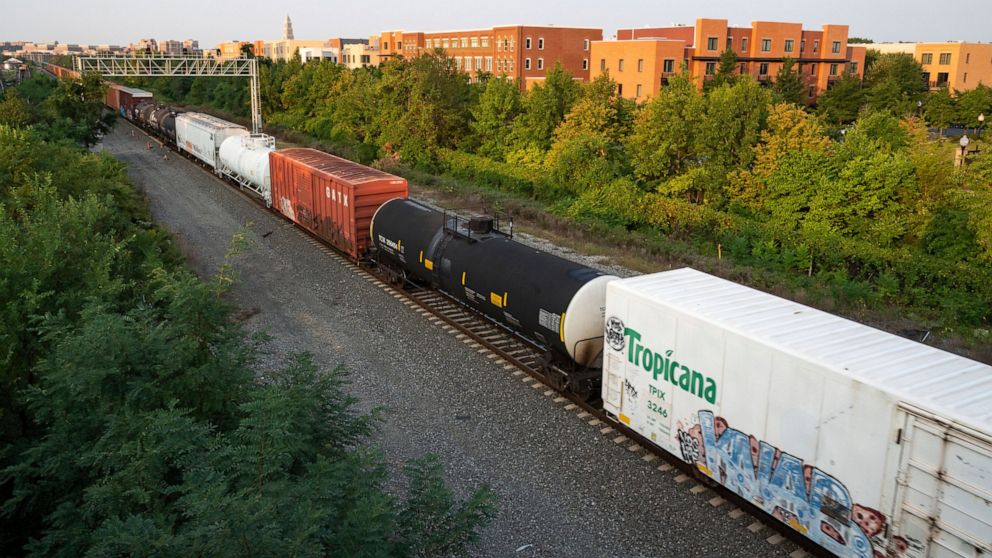 A CSX freight train travels through Alexandria, Va. on Thursday, Sept. 15, 2022. President Joe Biden said Thursday that a tentative railway labor agreement has been reached, averting a strike that could have been devastating to the economy before the