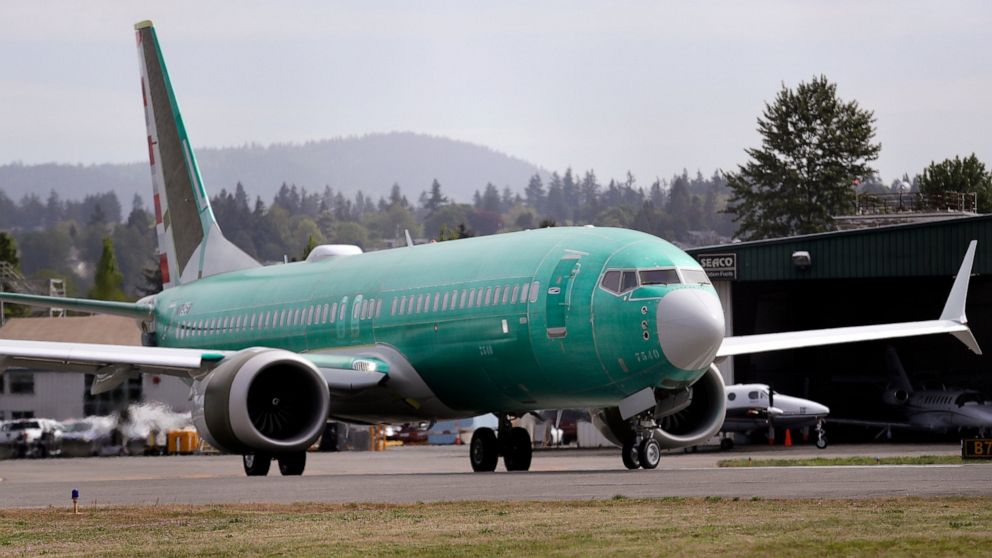 FILE - In this May 8, 2019, file photo a Boeing 737 MAX 8, being built for American Airlines, makes a turn on the runway as it is readied for takeoff on a test flight in Renton, Wash. American Airlines is now removing the Boeing 737 Max from its sche