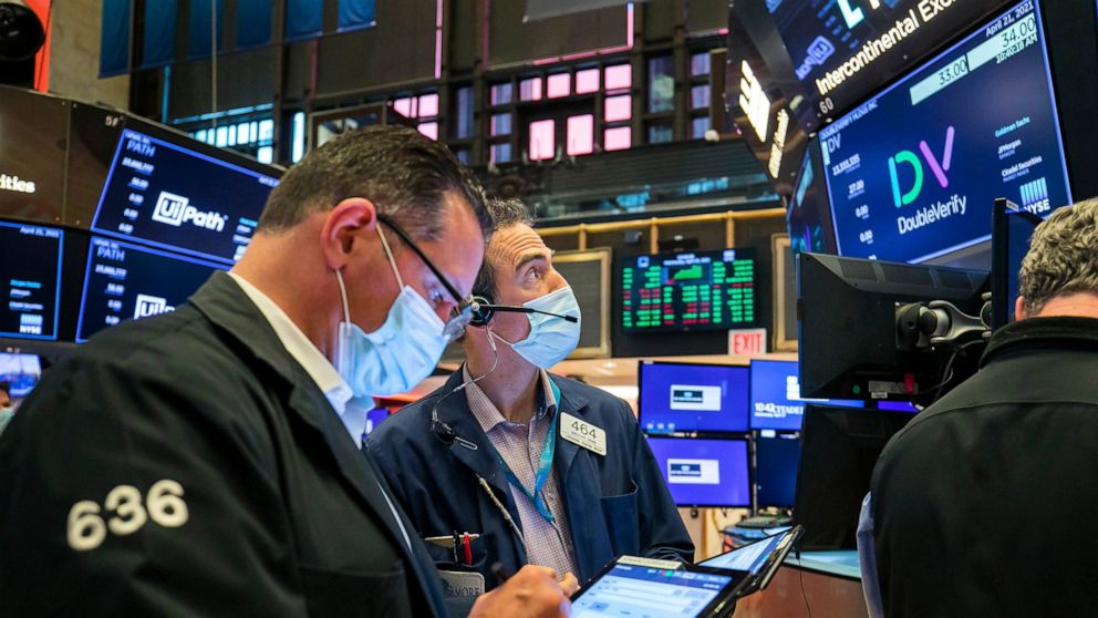 In this photo provided by the New York Stock Exchange, traders work on the floor, Wednesday April 21, 2021. Stocks were mostly higher in afternoon trading Wednesday as investors continued to work through company earnings reports and closely watch the