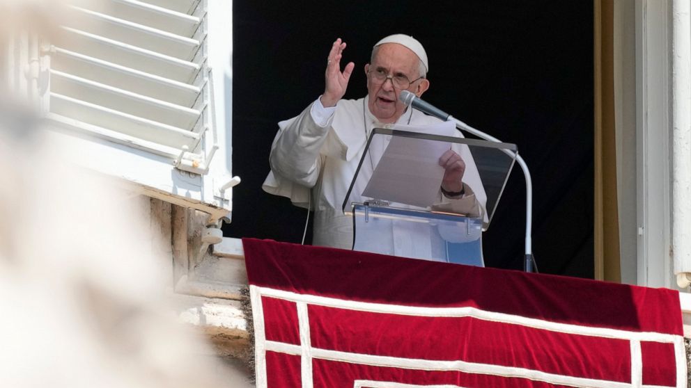 Pope Francis blesses the crowd as he recites the Angelus noon prayer from the window of his studio overlooking St.Peter's Square, at the Vatican, Sunday, July 18, 2021. (AP Photo/Alessandra Tarantino)