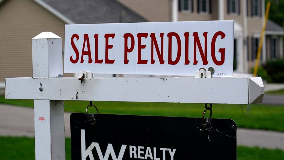 FILE - A "sale pending" sign is posted outside a single family home in a residential neighborhood, Wednesday, July 14, 2021, in Derry, N.H. Mortgage rates were mixed last week. The key 30-year home loan remained below 3% for the fifth straight week a
