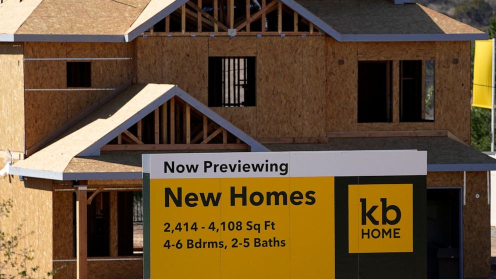 FILE - A sign sits in front of a KB Home construction site, Tuesday, Feb. 2, 2021, in Simi Valley, Calif. The Biden administration is giving state and local governments greater flexibility in spending $350 billion in federal COVID-19 relief funds. Th