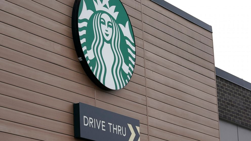 FILE - This Oct. 27, 2020, file photo shows a sign at a Starbucks Coffee store in south Seattle. Starbucks said Monday, Nov. 2, 2020, it plans to open an outlet in Laos as it expands its more than 10,000 stores in Asian countries. The company said it