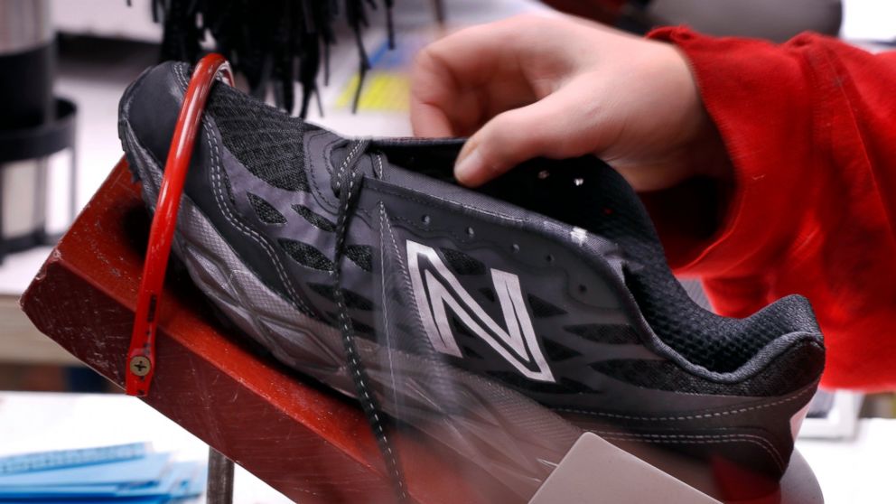 FILE- In this Dec. 17, 2018, file photo, a pair of athletic shoes designed for the military are laced up at a New Balance factory in Norridgewock, Maine. On Friday, Feb. 15, 2019, the Federal Reserve reports on U.S. industrial production for January.