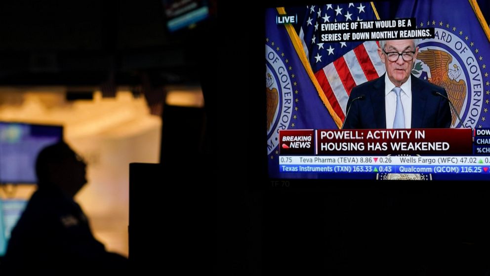 Traders work on the floor at the New York Stock Exchange as the Federal Reserve chairman Jerome Powell speaks after announcing a rate increase in New York, Wednesday, Nov. 2, 2022. (AP Photo/Seth Wenig)