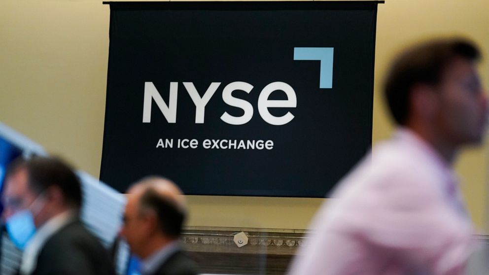 An NYSE sign is seen on the floor at the New York Stock Exchange in New York, Wednesday, June 15, 2022. Stocks are opening lower on Wall Street, Wednesday, June 22, as sharp drops in crude oil prices pull energy companies lower. Big technology stocks
