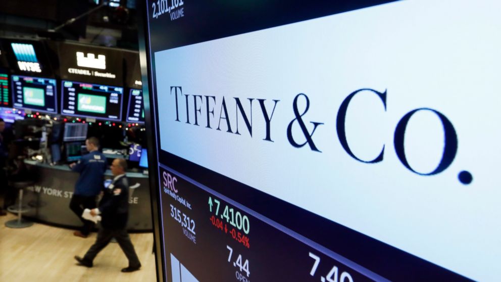 FILE - In this Nov. 28, 2018 file photo, the logo for Tiffany & Co. appears above a post on the floor of the New York Stock Exchange. The luxury jeweler, famous for its little blue boxes, says sales slipped in the holiday shopping season as Chinese t