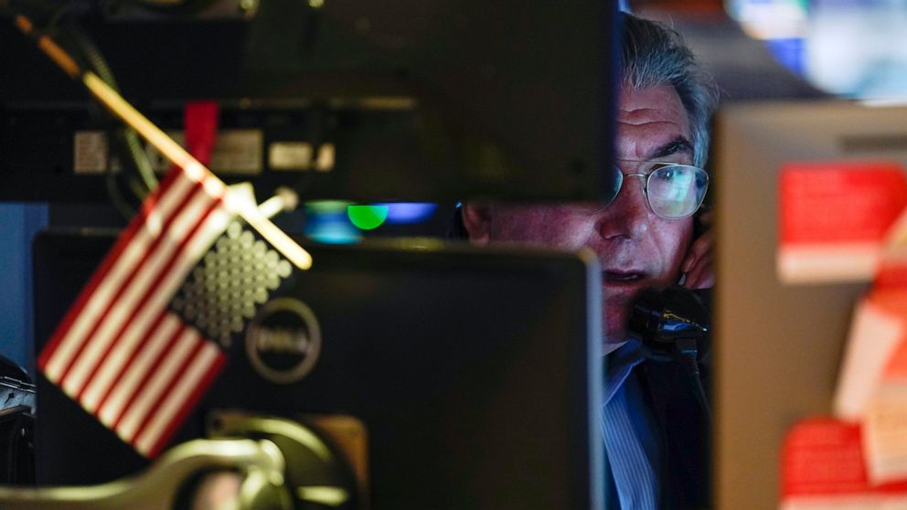 Traders work on the floor at the New York Stock Exchange in New York, Tuesday, June 14, 2022. Wall Street is wobbling between gains and losses Tuesday in its first trading after tumbling into a bear market on worries about a fragile economy and risin