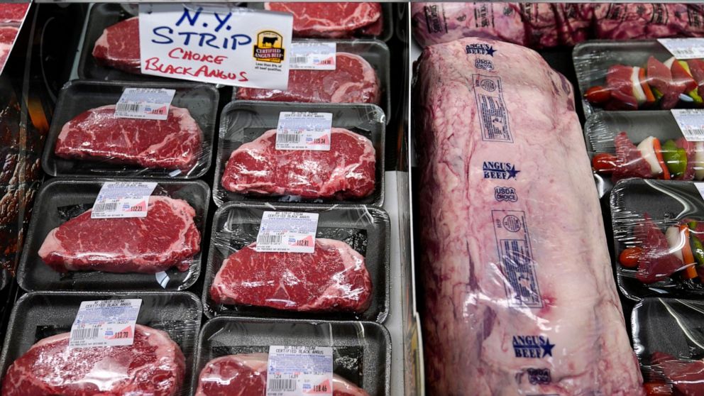 In this Tuesday, June 15, 2021 photograph, beef is displayed in the meat department at Lambert's Rainbow Market, in Westwood, Mass. Prices at the wholesale level surged by a record 9.6% in November 2021, from a year earlier, an indication of on-going
