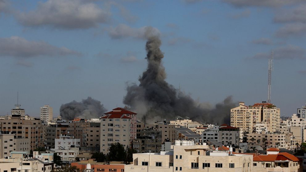 FILE - An Israeli air strike hits a building in Gaza City, May 17, 2021. Actions by Facebook and its parent Meta during last year's Gaza war violated the rights of Palestinian users to freedom of expression, freedom of assembly, political participati