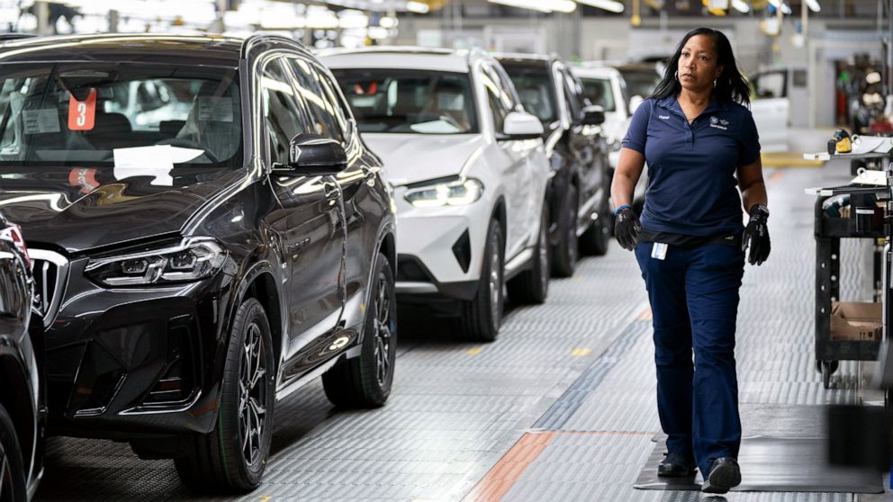 An employee works in the X3, X45 assembly hall at the BMW Spartanburg plant in Greer, S.C. Wednesday, Oct. 19, 2022. BMW's sprawling factory near Spartanburg, will get a $1 billion investment, and the German automaker will spend another $700 million 