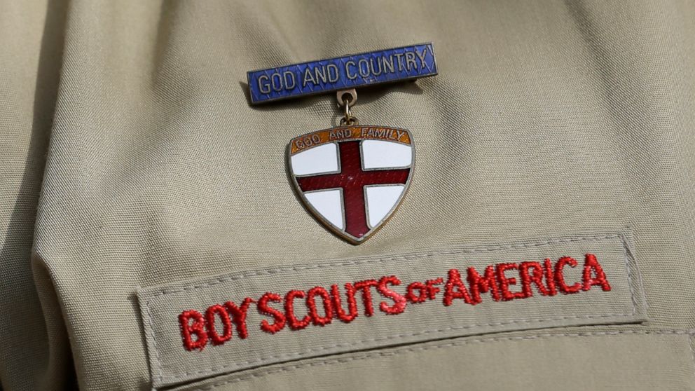 FILE - A close up of a Boy Scout uniform is photographed on Feb. 4, 2013, in Irving, Texas. Attorneys for the Boy Scouts of America say protecting local BSA councils and troop sponsoring organizations from future liability for child sex abuse claims 