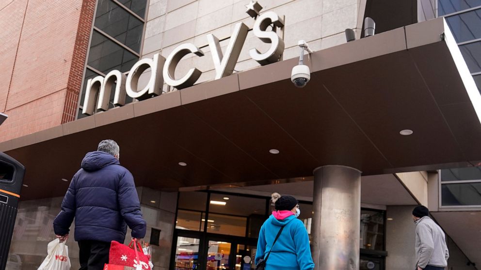 Shoppers walk to the Macy's store in the Downtown Crossing district, Wednesday, Nov. 17, 2021, in Boston. Macy’s reported better-than-expected results for the fiscal first quarter, Thursday, May 26, 2022, even as the department store chain faces high